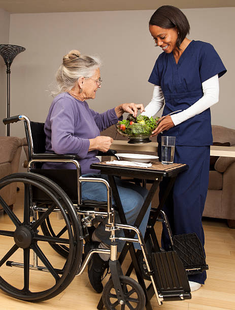 Caregiver preparing a healthy meal in a senior client’s kitchen in Central Florida